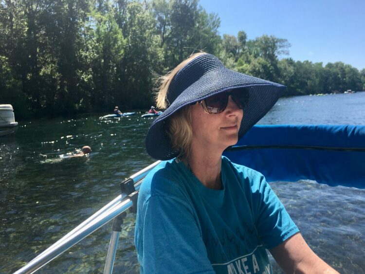 a woman on a boat in the water
