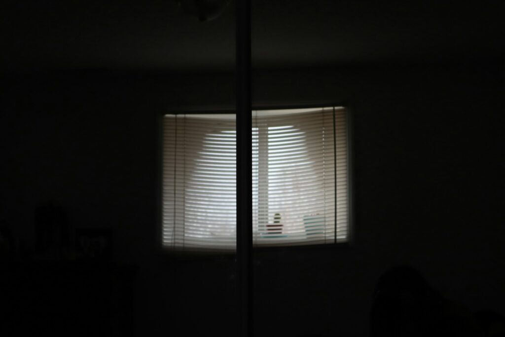white window blinds on window