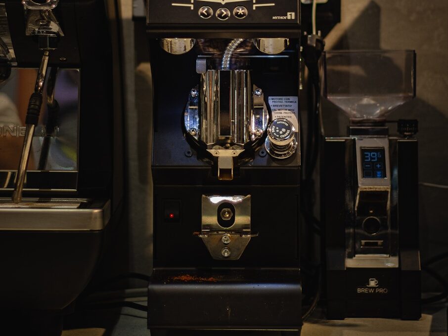 an espresso machine sitting next to a coffee maker