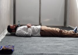 a man laying on the floor in a room