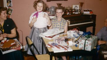 a group of people sitting around a table