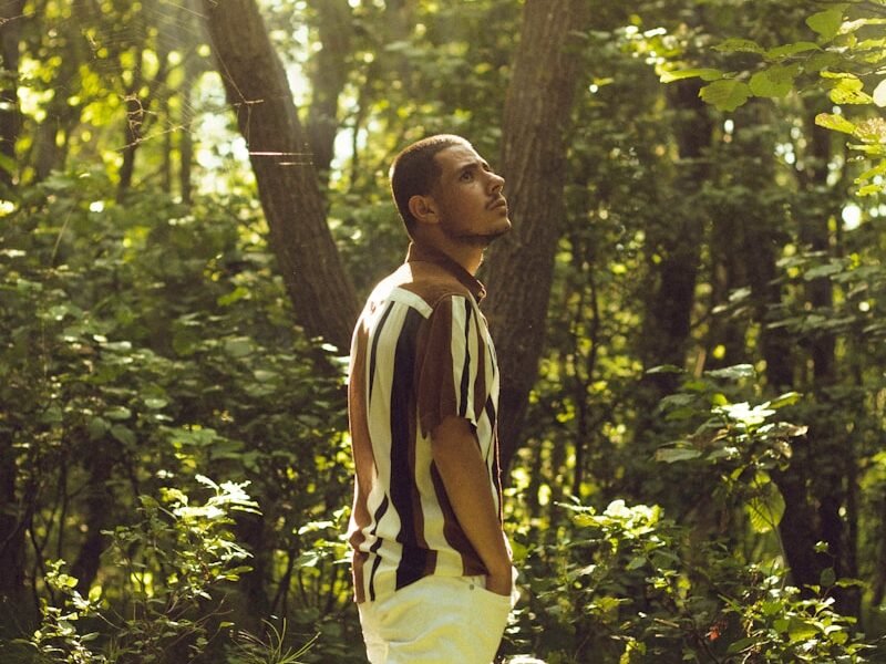 a man standing in a forest