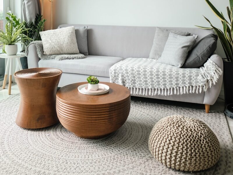 a living room filled with furniture and a large window