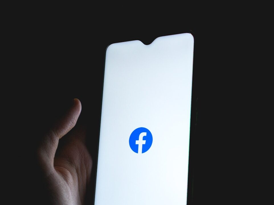 white apple device with blue logo