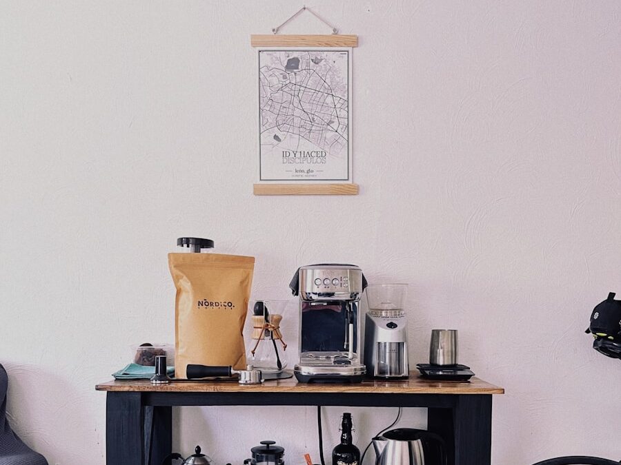 a table with a coffee maker, coffee pot, and other items on it