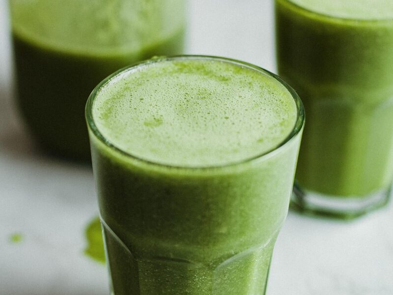 green liquid in clear drinking glass