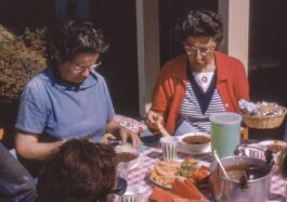 women sitting beside table