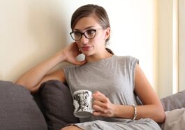 woman sitting on sofa