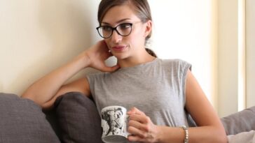 woman sitting on sofa