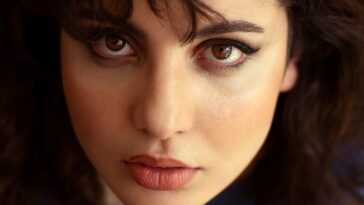 a close up of a woman with dark hair