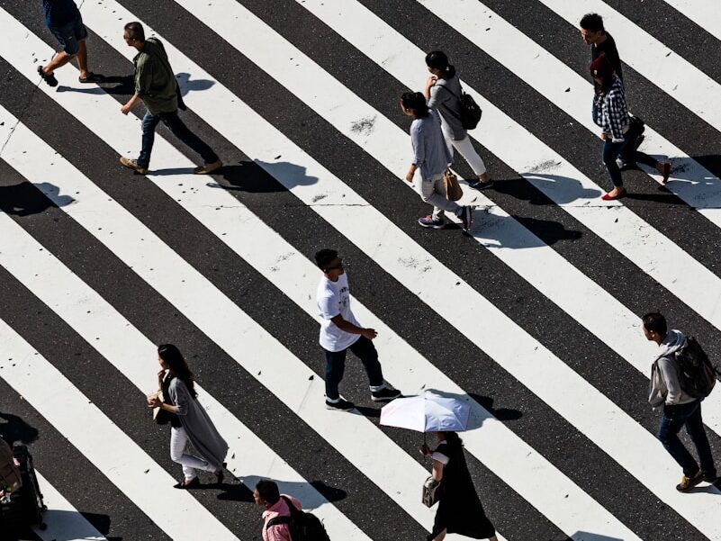 peoples walking on pedestrian lane