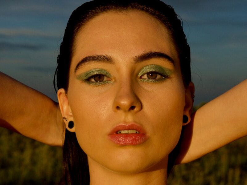 man wearing black spaghetti strap top