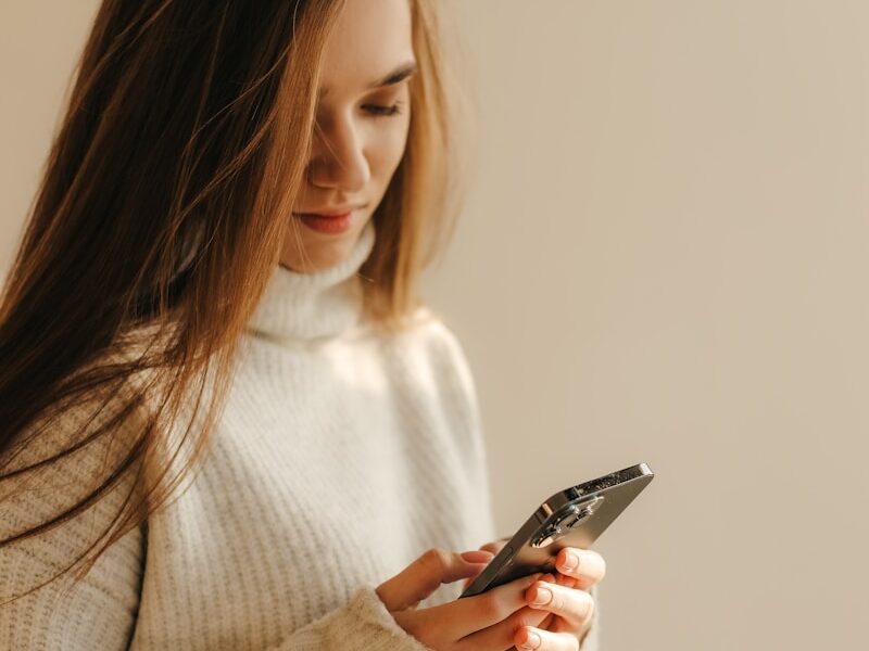 a woman looking at her phone