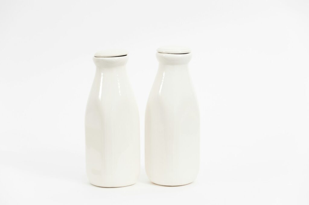two white milk bottles