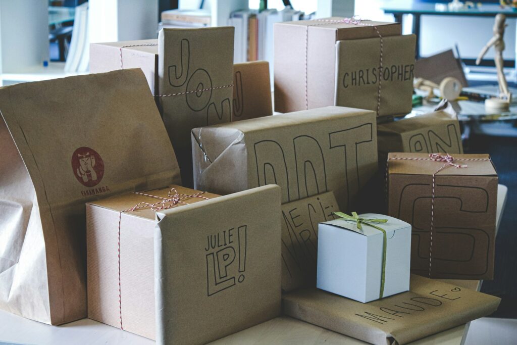 a pile of brown paper bags sitting on top of a table