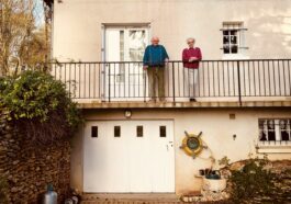 white concrete building near green trees during daytime
