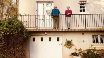 white concrete building near green trees during daytime