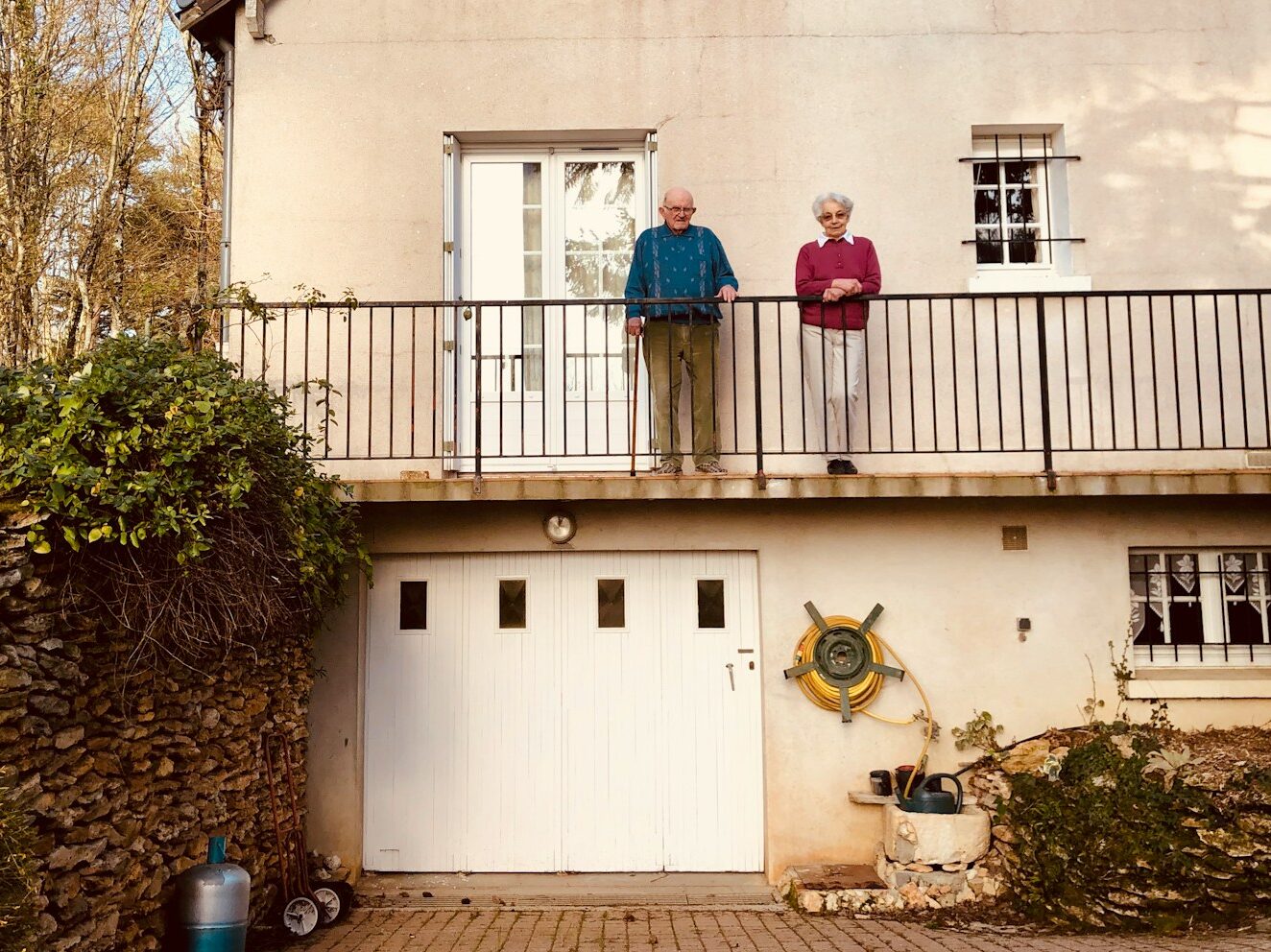 white concrete building near green trees during daytime