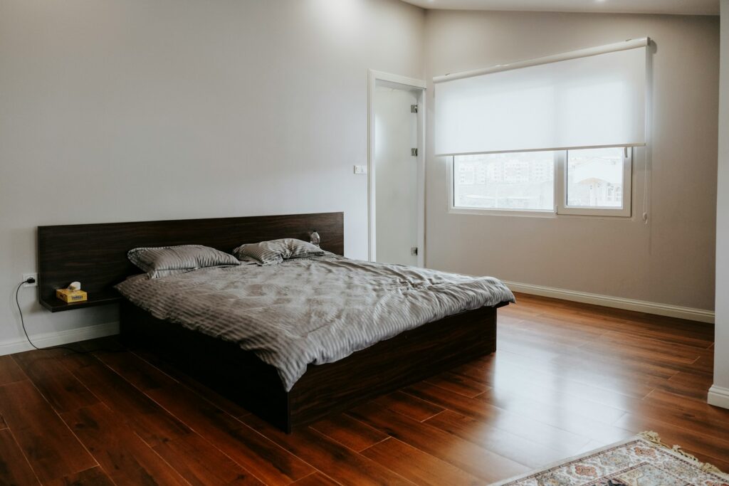 white bed linen on bed