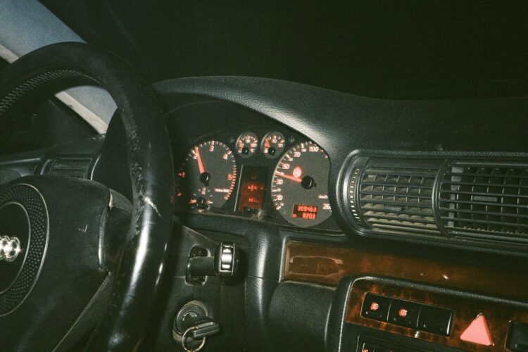the dashboard of a car with a dash light on