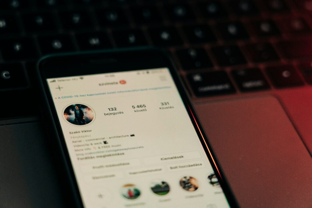 black android smartphone on macbook pro