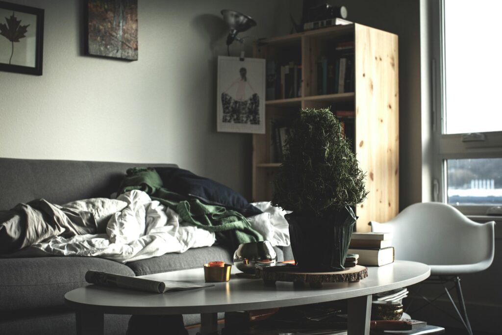 oval white wooden coffee table near vacant sofa