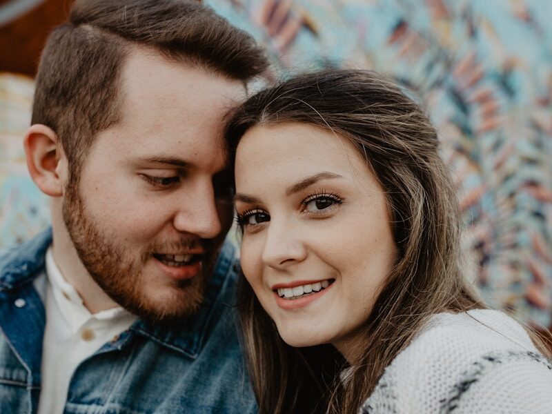woman and man wearing white sweater