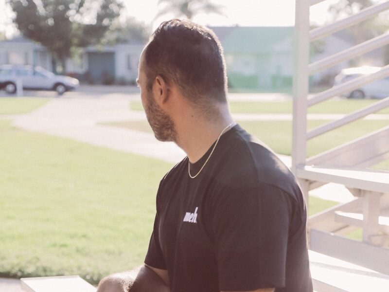 a man holding a skateboard