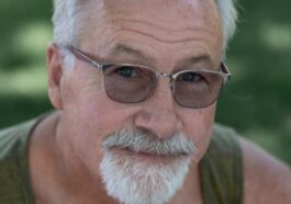 a man with a white beard wearing sunglasses