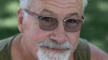 a man with a white beard wearing sunglasses