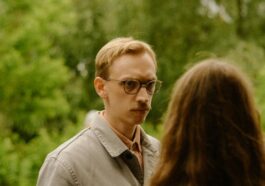 a group of people standing around each other