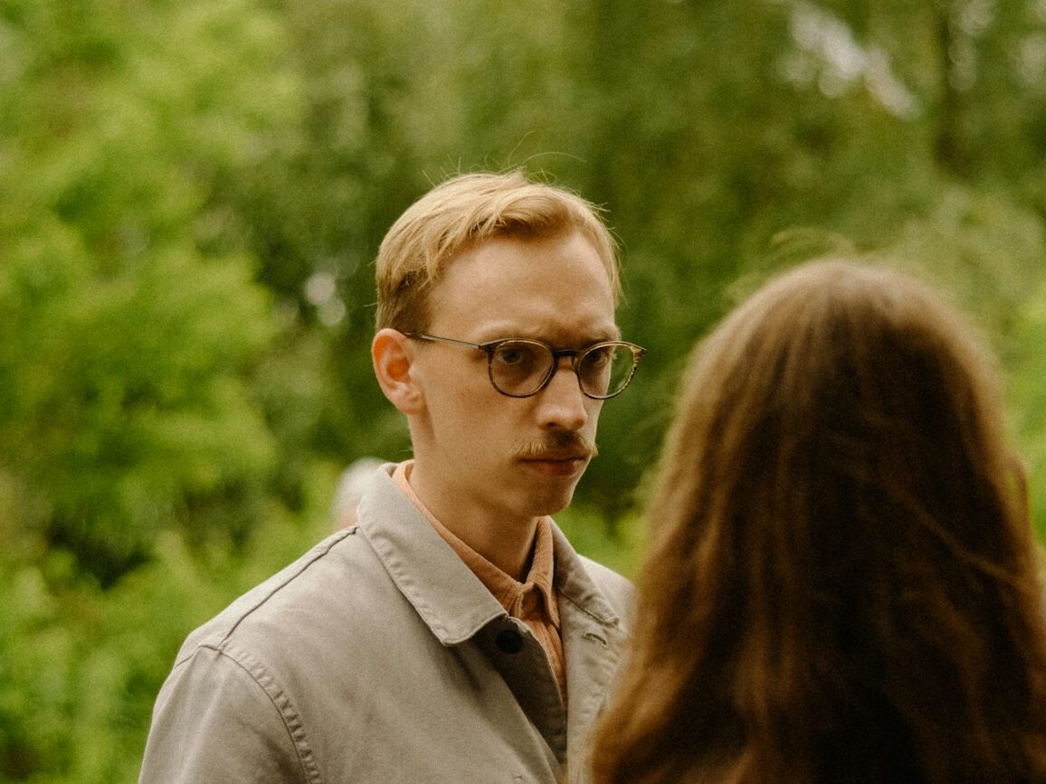 a group of people standing around each other