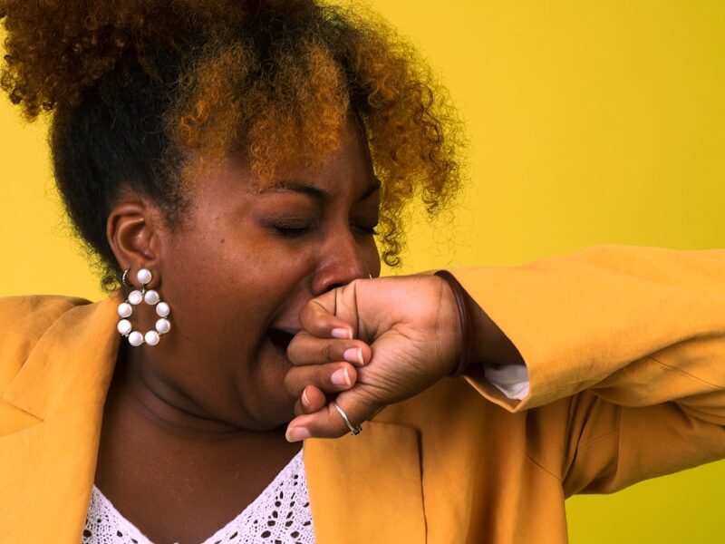 a person with the hand on the face